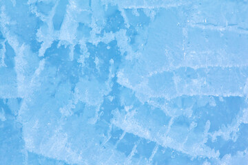 Texture of winter ice surface. Blue natural ice background