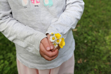 Child holding flowers