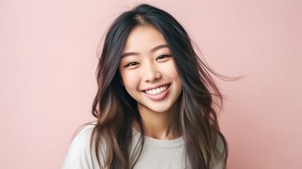 Naklejka premium Smiling fancy fascinating young woman of Asian ethnicity 20s years old on plain pastel light pink background. People emotions lifestyle concept. Generative AI.