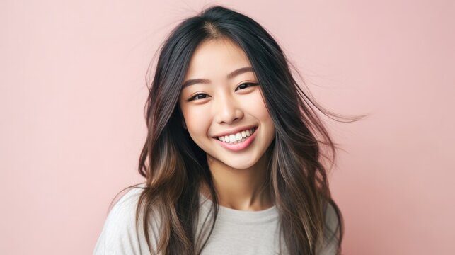 Smiling fancy fascinating young woman of Asian ethnicity 20s years old on plain pastel light pink background. People emotions lifestyle concept. Generative AI.