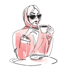 A modern stylish girl in sunglasses, a jacket and a headscarf is drinking coffee at a cafe table. Vector sketch with marker and watercolor, fashion illustration. - obrazy, fototapety, plakaty