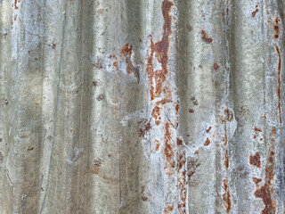 rusty galvanized sheet.old rusty galvanized sheet iron fence texture background.Rusty galvanized roof.