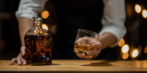 Barman pouring whiskey whiskey glass beautiful night
