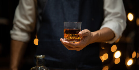 Barman pouring whiskey whiskey glass beautiful night