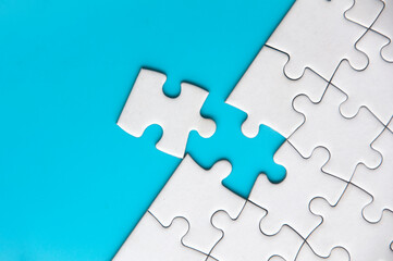 Separated jigsaw puzzle with customizable space for text. Copy space with blue background