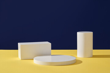 Front view of round and rectangular white empty platforms arranged on a color background. Minimal scene mockup cosmetic product stage showcase