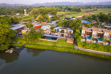 Obraz premium Aerial view of River Kwai and floating houses in Kanchanaburi province, Thailand