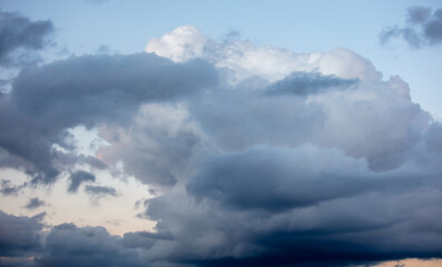 Rain clouds at sunset as background