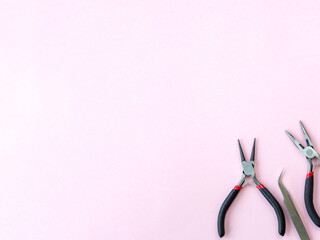 pliers, pliers, round pliers, tweezers, tools for jewelry and jewelry creation. dIY. background with space for text.