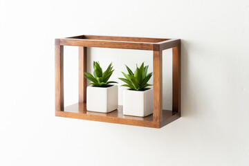 two wooden planters sitting on top of a shelf next to each other