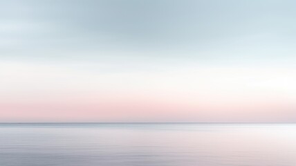 Clear blue sky sunset with glowing pink and purple horizon on calm ocean seascape background....