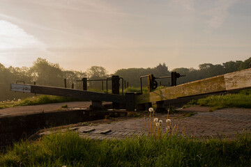 Canal lock gate on a sunny misty morning. Tyrley Locks on the Shropshire Union Canal.