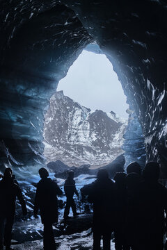 Explorers Inside Katla Glacier Ice Cave, Iceland