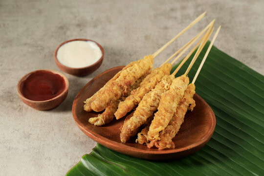 Telur Gulung, Rolled Egg with Skewers. Popular Street Food in Indonesia.
