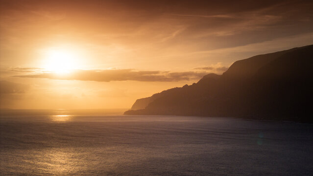 Golden Horizon: Aerial Drone Perspective of Sunset on Madeira Coastline