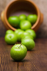 Fresh and green plum on wood	