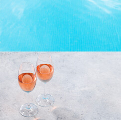 Refreshing rose wine by the pool on a sunny day