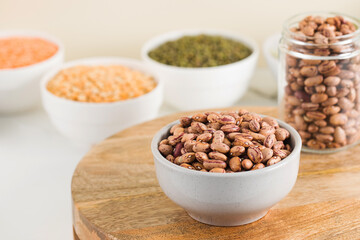 Raw pink beans in a bowl. Protein protein. Healthy eating.