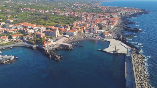 View of Stazzo old city, Catania, Sicily, Italy. Summer beach and sea