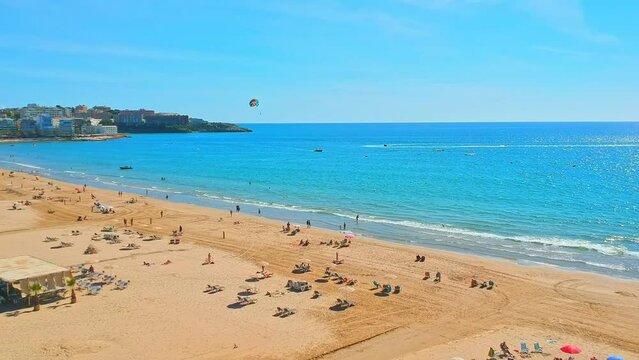 Beach, blue sea and palm trees in Salou city, Catalonia, Spain, Europe