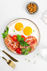 Fried Eggs and Bacon with Cherry Tomatoes on Plate, Breakfast, Keto, Paleo Diet Lunch