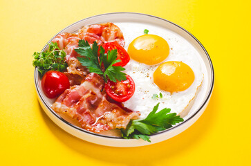 Fried Eggs and Bacon with Cherry Tomatoes on Plate, Breakfast, Keto, Paleo Diet Lunch