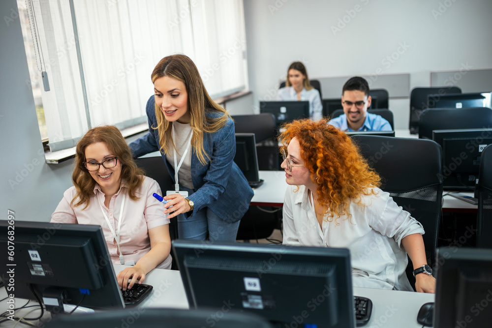 Wall mural educator and students in programming school