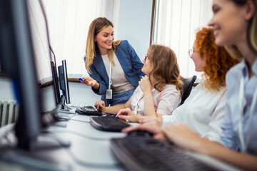 Educator and students in programming school