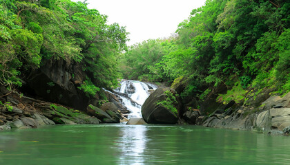 Beautiful waterfall with sunlight in jungle, Haew Suwat Waterfall.
