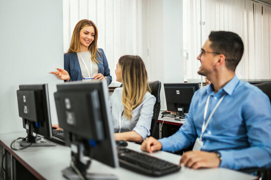 Educator and students in programming school