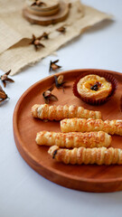 cheesy egg tart and cheese roll, crispy puff pastry with cheese stick inside.