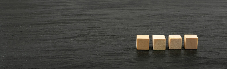 Four Cubes on a Black Stone Background, Word of 4 Letters Mockup