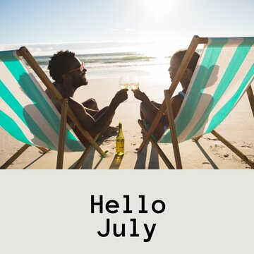 Composition of hello july text over african american couple with drinks on beach