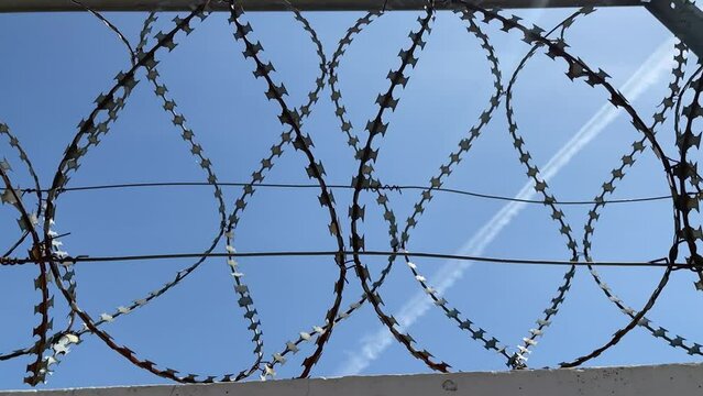 Barbed wire on a concrete fence