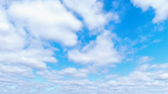 The white clouds gracefully dance across the canvas of the blue sky.
The blue sky is embellished with white clouds that gracefully drift and sway.