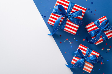 July 4th celebration setup with party supplies like sparkle confetti. Large gift boxes in symbolic...