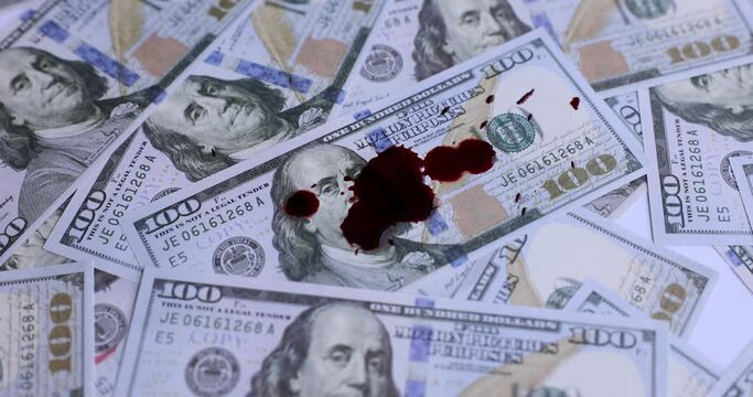 Dollars in red blood stains and criminal problems. Illegal sale of money and contract killing