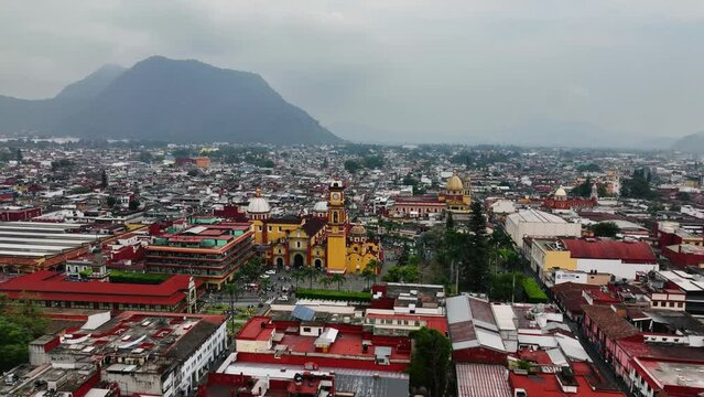 Aerial view rising over the cityscape of Orizaba, cloudy day in Veracruz, Mexico