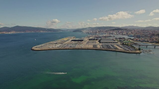 Aerial drone footage: Vigo river, city views, and Citro&euml;n's Zona Franca. Captivating glimpse into the vibrant Spanish city.