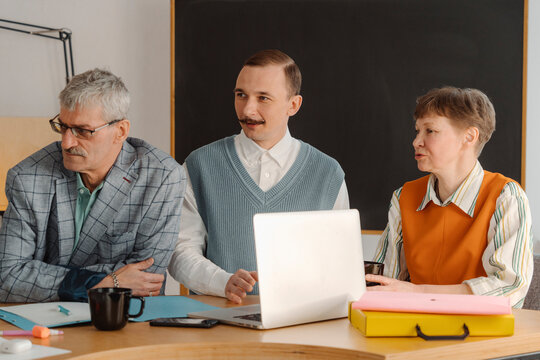 Colleagues talking with each other while recording online broadcast