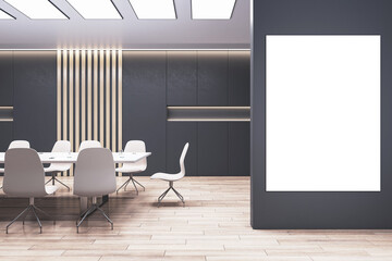 Front view on blank poster for advertising text or logo on black partition in modern meeting room interior design with dark decorated wall, wooden floor and stylish furniture. 3D rendering, mockup
