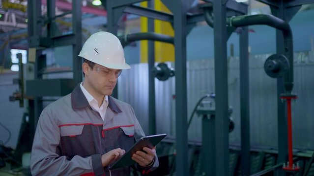 Engineer man Heavy industry plant Construction Factory for Oil, Gas Fuels Transport Pipeline using Technology tablet computer, Professional worker Hard Hat Industrial checking production Manufacture