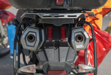 The rear motorcycle with mufflers, turn indicators and LED brake light.