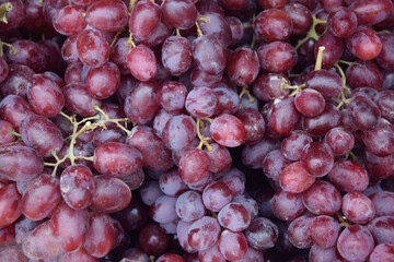 Red wine grapes background. Red Grape sold in the market.