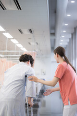 Fototapeta premium Nurses and physical therapists and their assistance and rehabilitation of patients. vertical