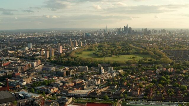 Aerial shot over Victoria Park towards Central London