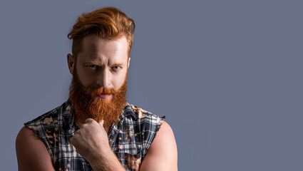 photo of brutal bearded guy with beard, advertisement. brutal bearded guy isolated on grey
