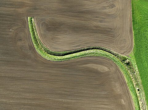 Aerial view of small scale agriculture and ploughing in Brandenburg, Germany.