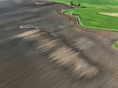 Aerial view of small scale agriculture and ploughing in Brandenburg, Germany.