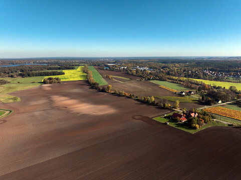 Aerial view of small scale agriculture and ploughing in Brandenburg, Germany.